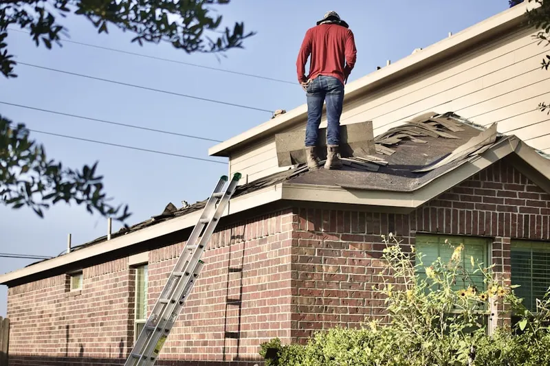 Professional roofer working on a residential roof in Rancho Fontana